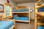 Two log Bunk beds and a Log Day bed with Trundle